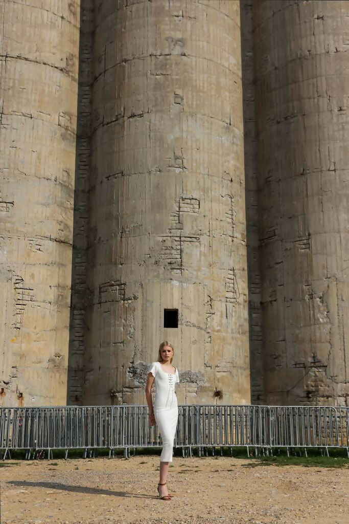 A young blonde woman in White Midi Dress