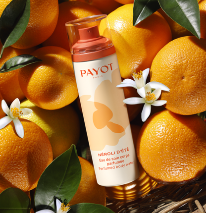 Payot Nerolí D'Été Perfumed Body Water 100 ml background with oranges